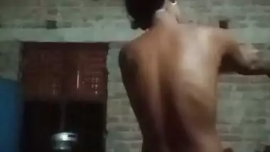 Village girl applying lotion to full nude body