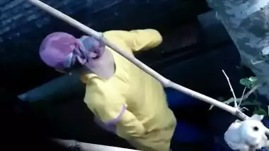 Desi XXX voyeur films Indian housewife in headscarf washing clothes