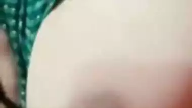 Stripchat girl Trisha playing with naked boobs