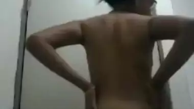 Female shows off her sex titties and rubs XXX clitoris in the corner