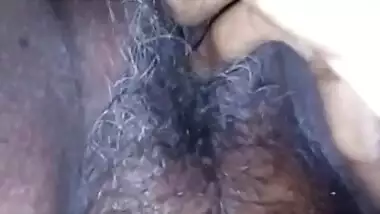 Fingering wet and hairy pussy